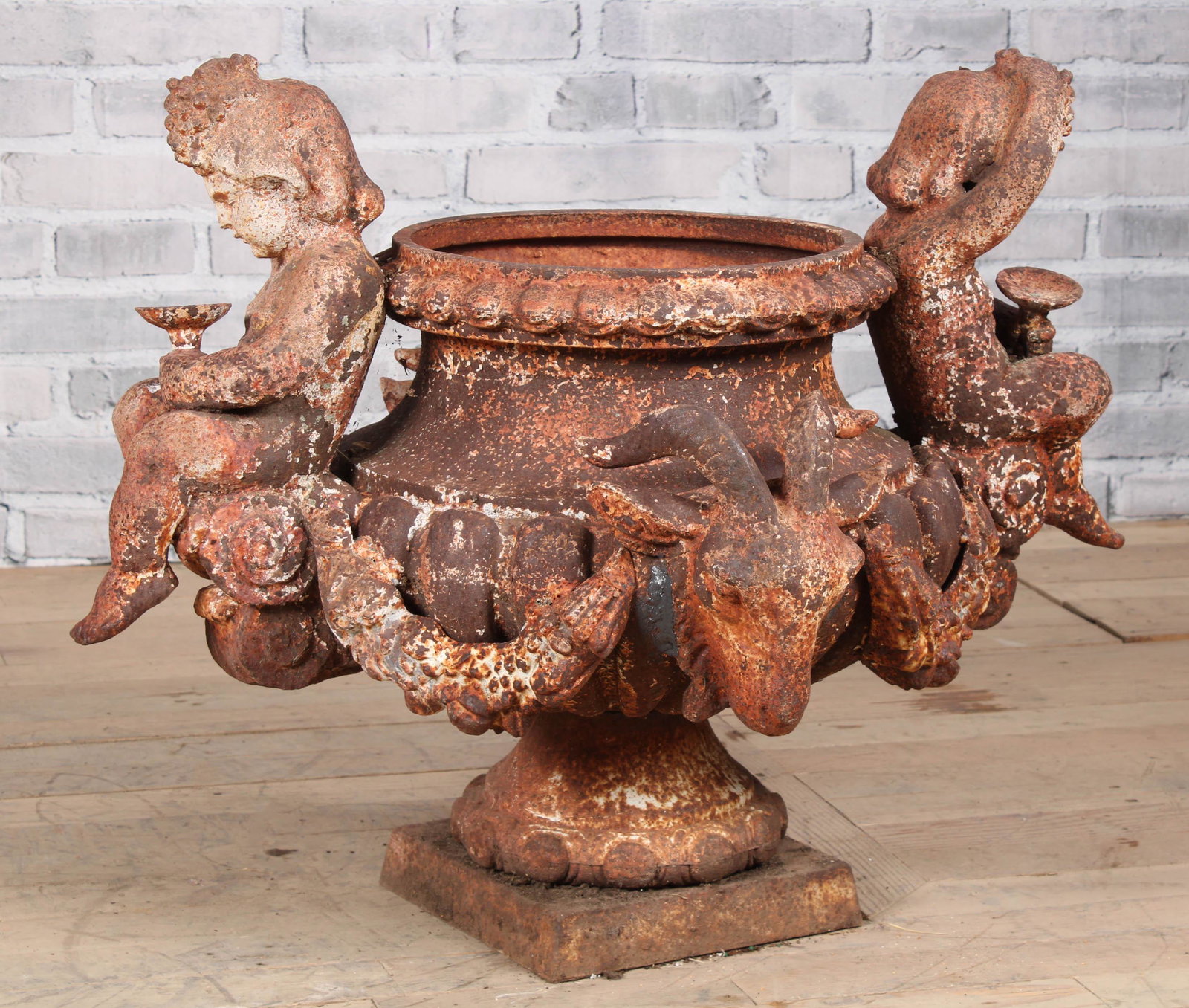 Cast Iron Bacchanalia Motif Garden Urn: Cast Iron Bacchanalia Motif Garden Urn. Size: H 25.5" x W 33.5" x D 26"