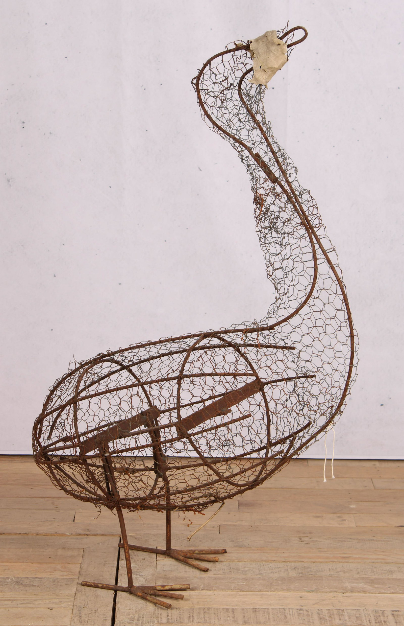Wirework Goose Garden Topiary Form: A whimsical wirework standing bird topiary form. Size: 44"H x 31"W x 11"D