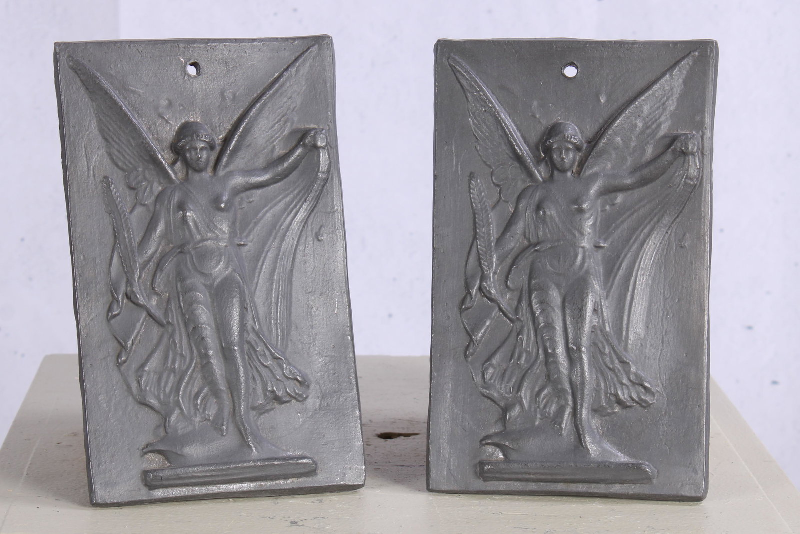 Pair English Cast Lead Nike Motif Appliques: A pair of cast lead Nike decorated plaque. Size: 9.5"H x 5.75"W