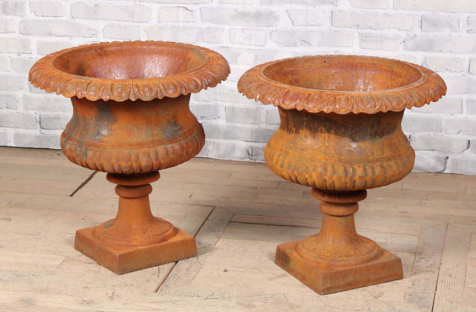 Pair Egg and Dart Cast Iron Urns: Pair Egg and Dart Cast Iron Urns. Measured: H 24" x W 23" x D 23"