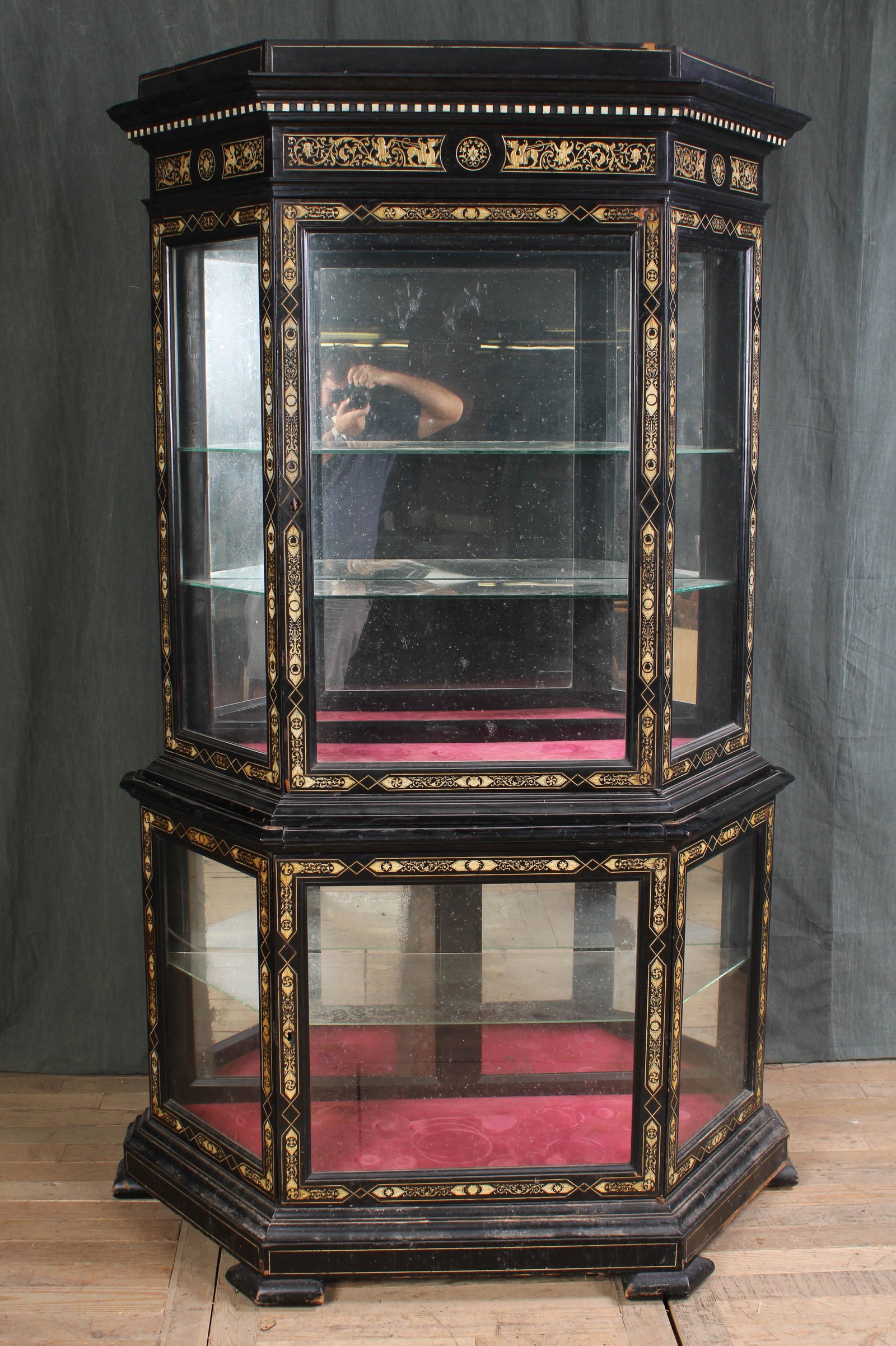 Italian Ebonized and Bone Inlaid Vitrine: A very good late 19th century Italian ebonized and bone inlaid vi trine. The upper case with dentil molding over figural frieze and central door all framed by intricate inlay. The can forming base wit
