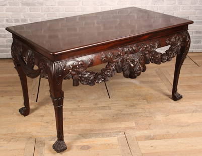 William Kent Style Serving Table, Labeled Baker: William Kent Style Mahogany Console Table. With a central lion mask flanked by draped garland and diaper work all supported on cabriole legs with hairy paw feet. Size: 33.75"H x 60"L x 36"W