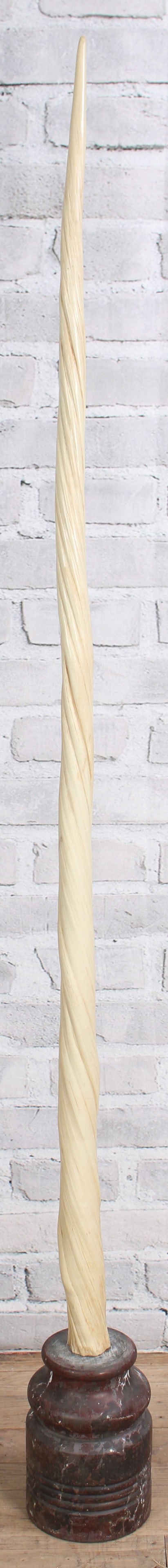 Faux Narwhale Tusk on Marble Base: A very realistic faux narwhale tusk mounted on stone base. Size: 66"H x 6"W x 8"D