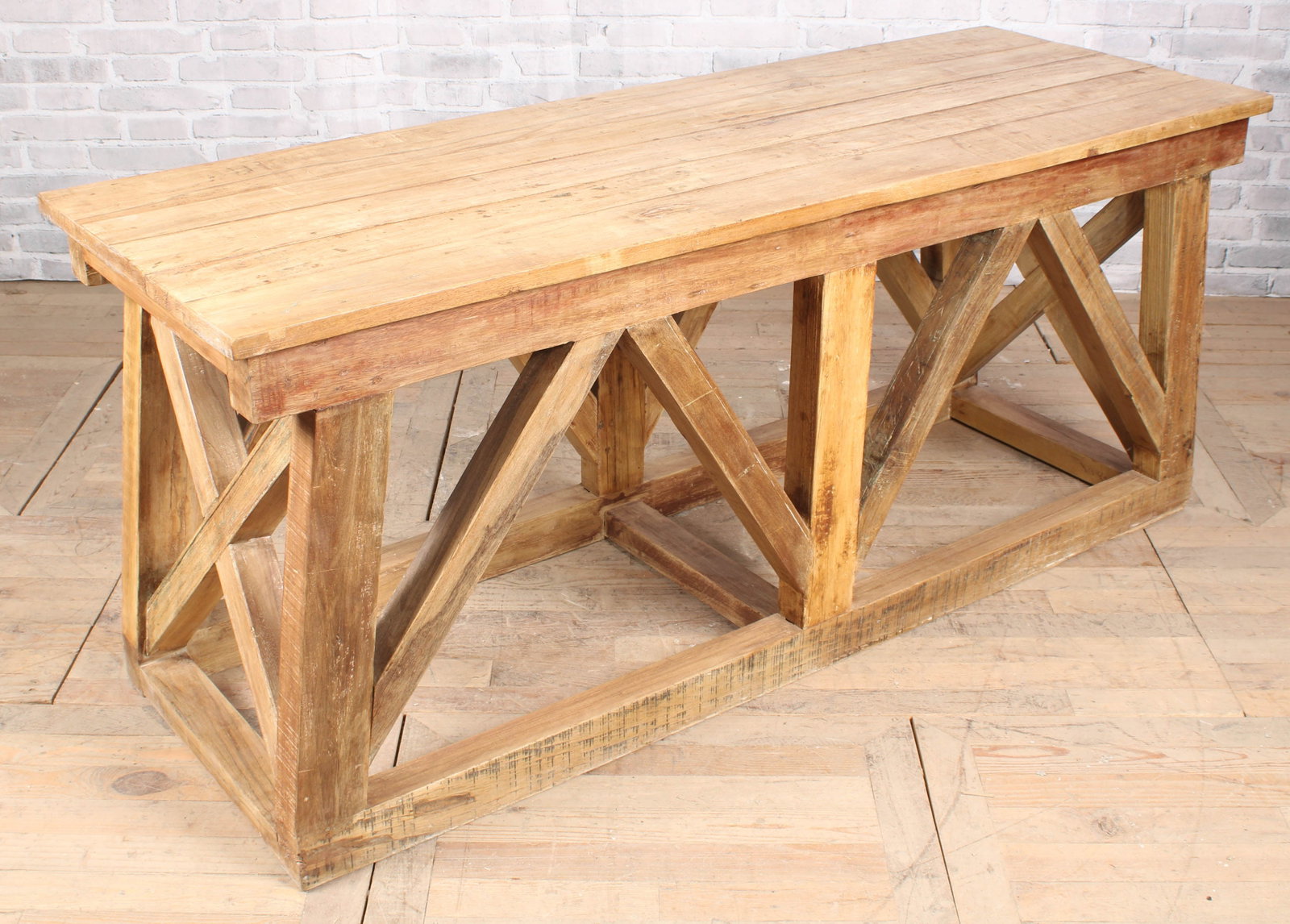 Architectural Bridge Form Trestle Table: A strong architectural designed consol table having bridge form flared base. Size: 31.5"H x 74"W x 26"D