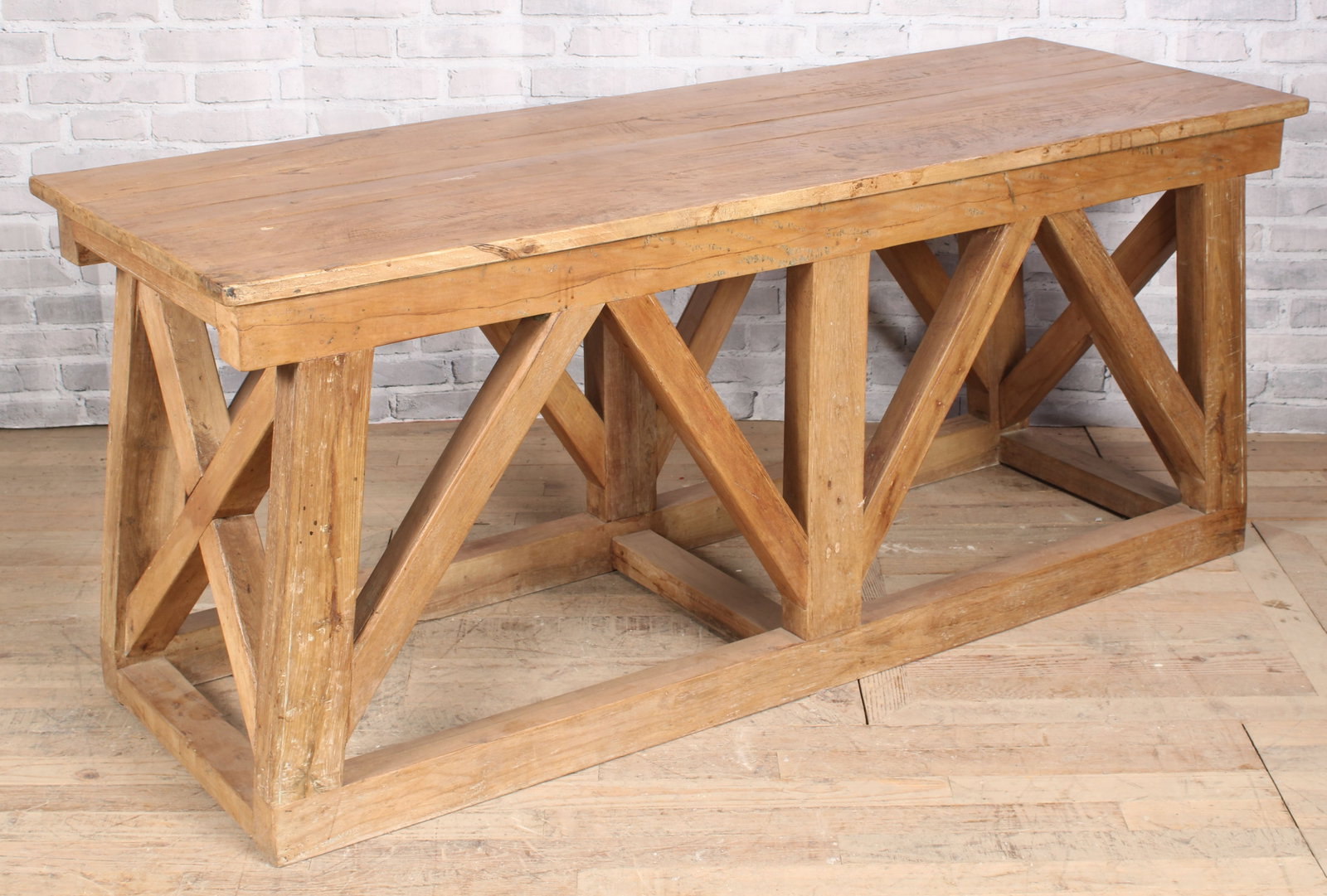 Architectural Bridge Form Trestle Table: A strong architectural designed consol table having bridge form flared base. Size: 31.5"H x 74"W x 26"D