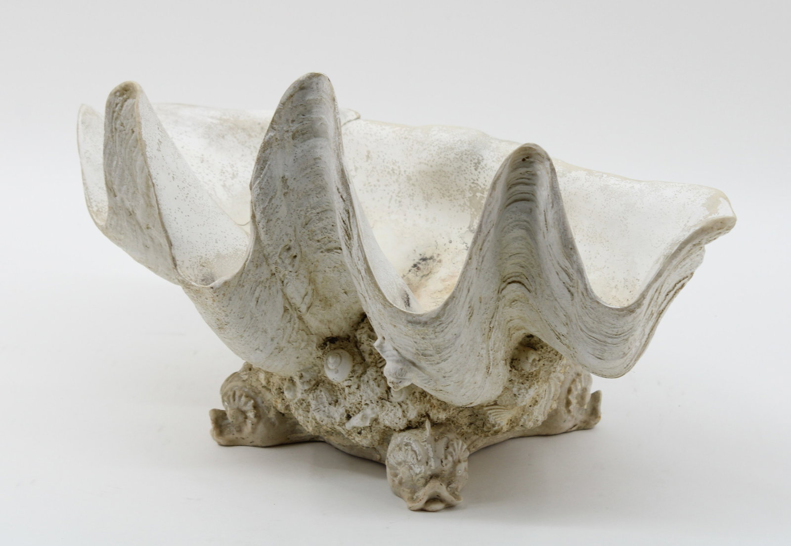 Grotto Decor, Clamshell on Dolphin Pedestal Feet: Grotto Decor, Clamshell on Dolphin Pedestal Feet. Resin composition. Size: 11 x 20 x 12