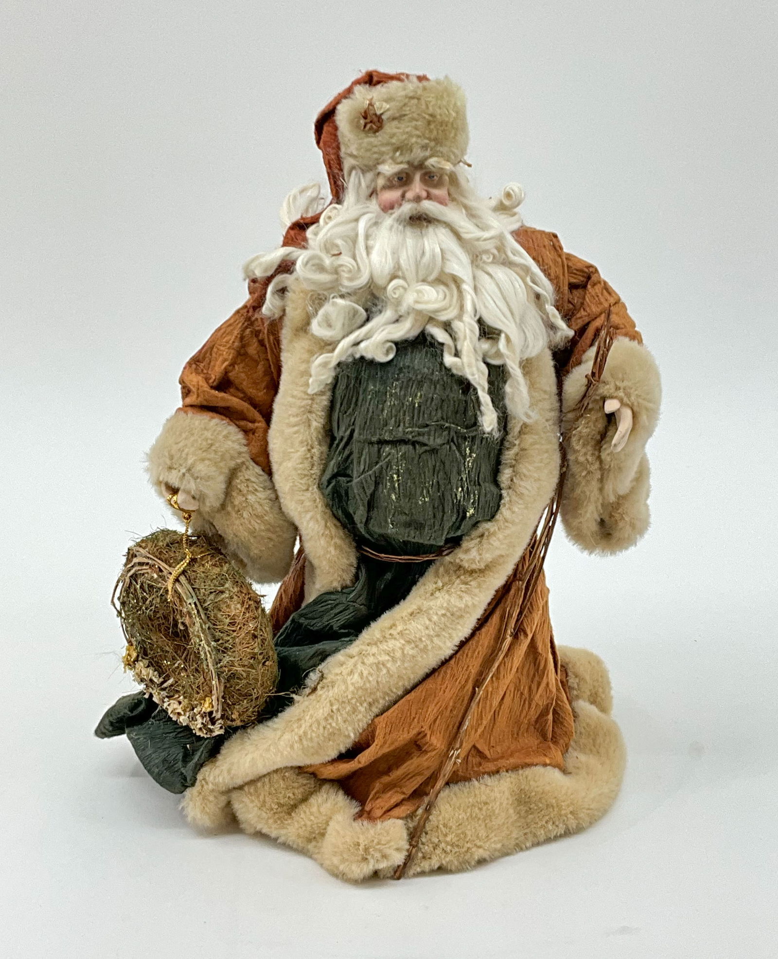 Windswept Santa & Wreath: Windswept Santa , you can really feel the breeze from the North making his robe flutter. Paper Mache. From a single owner collection, PA estate, stored in a glass cabinet. Size: H 16" x W 11" x D 7" S