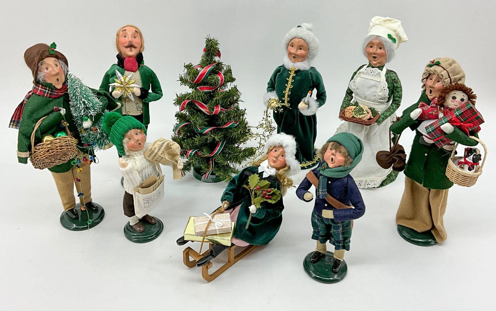 Green Velvet Carolers, Byers Choice: A coordinating group of green velvet carolers from Byer's Choice. From a single owner collection, PA estate, stored in box. See photos for dates. Size: approximately H 13.5" x W 8" x D 5.5" Shipping N