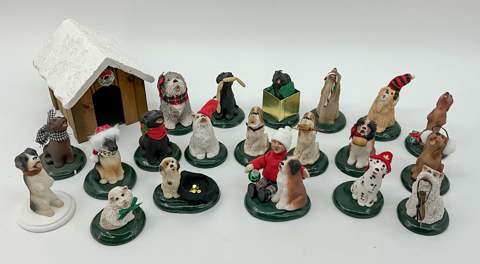 Byer's Choice Dog Collection: 20 Byer's Choice holiday dogs and bonus dog house. See photos for dates. From a single owner collection, PA estate, stored in box. Size: H 6.5" x W 6.5" x D 7.25" Shipping Note: For your convenience, 