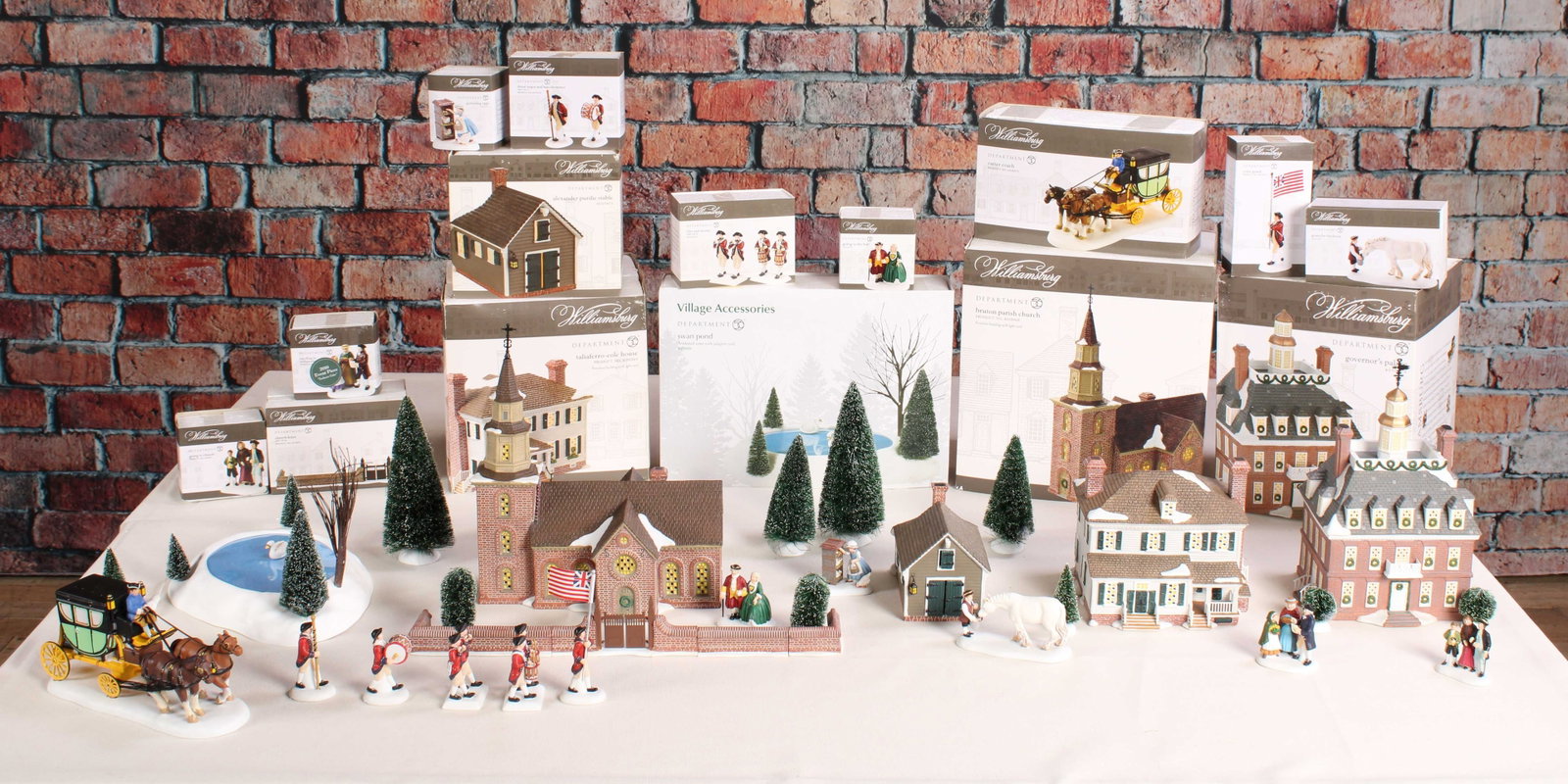 Williamsburg Scenic Pieces, Holiday Village: Generous group of Department 56 Williamsburg village pieces. From a single owner collection, PA estate, Box Stored. Size: various largest 12"T Shipping Note: For your convenience, we have arranged wit