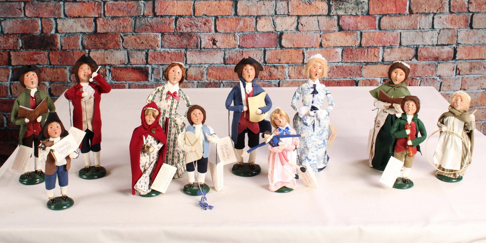 Williamsburg Collection Holiday Carolers, Byer's: A collection of 12 carolers from the Williamsburg Byer's Choice collection. See photos for dates. From a single owner collection, PA estate, stored in a box. Size: approximately 14"T x 5" diameter Shi
