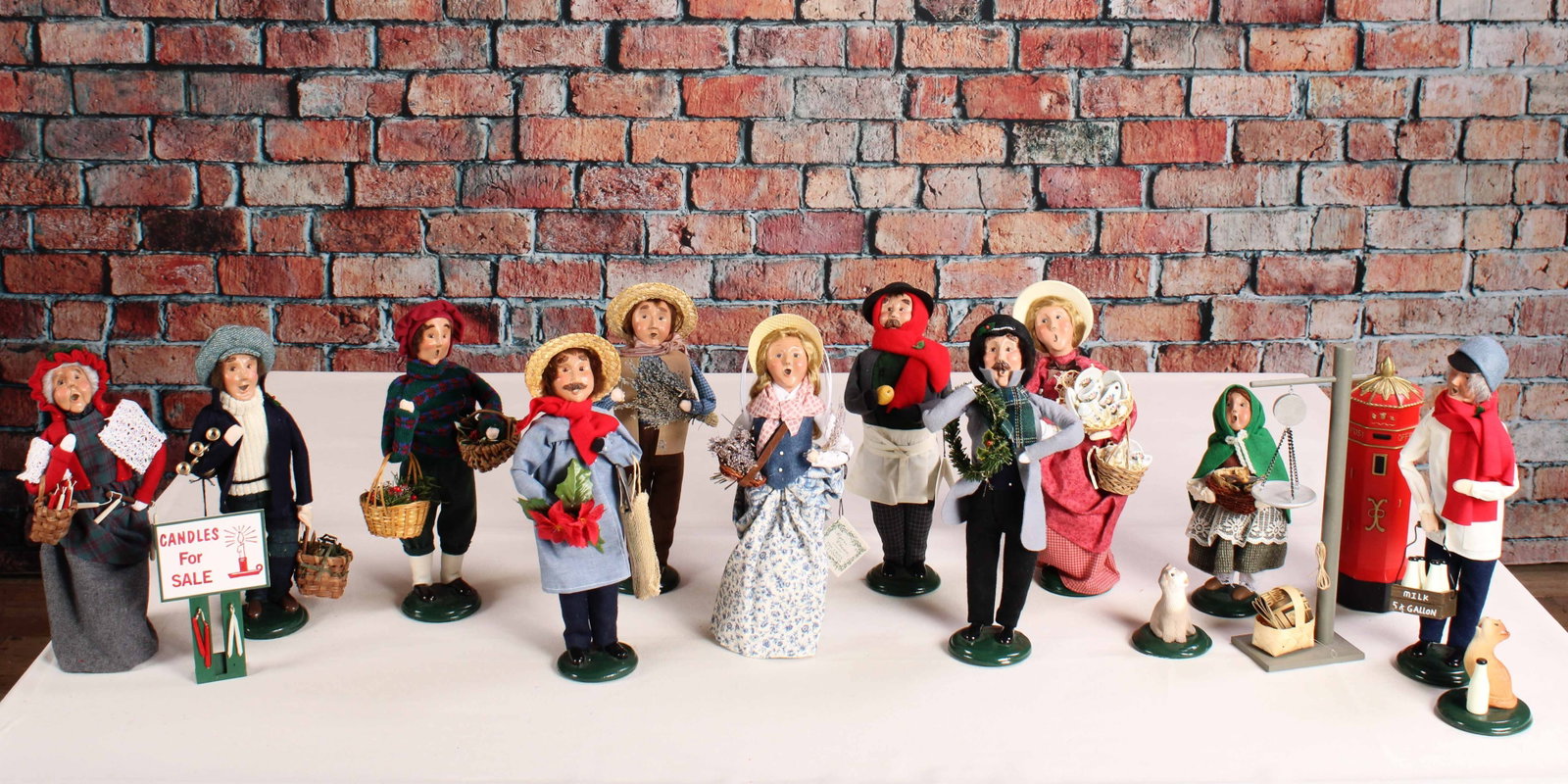 Crier's of London, Byer's Choice: 11 carolers from the Crier's of London Collection by Byer's Choice and a couple of bonus props and cats. Most have tags attached. See photos for release dates. From a single owner collection, PA estat