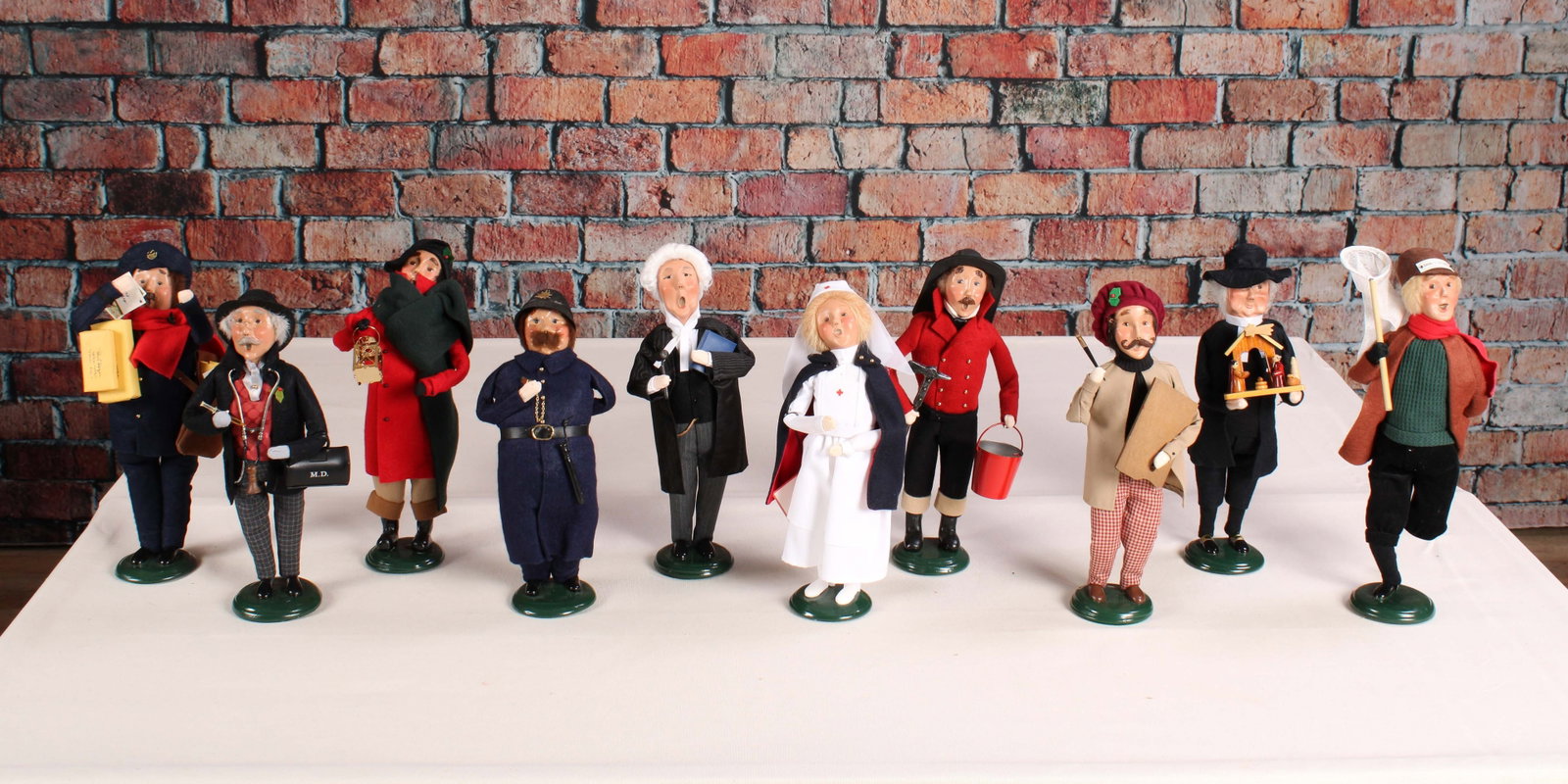 Carolers of Various Careers from Byer's Choice: 10 Byer's Choice carolers all showcasing a different career, doctor, nurse, fireperson, artist, dog catcher, something for everyone! Some signed. See photos for dates. From a single owner collection, 