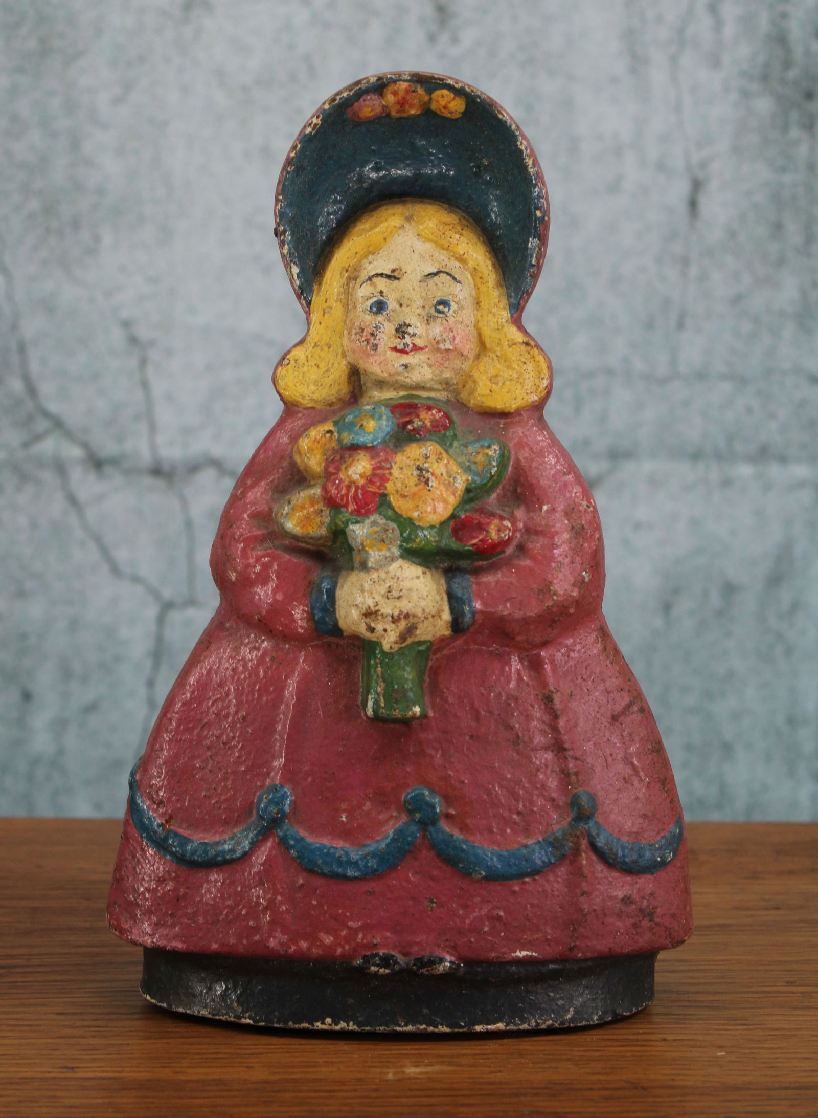 Cast Iron, Young Girl Bonnet and Bouquet Doorstop (1 of 5)