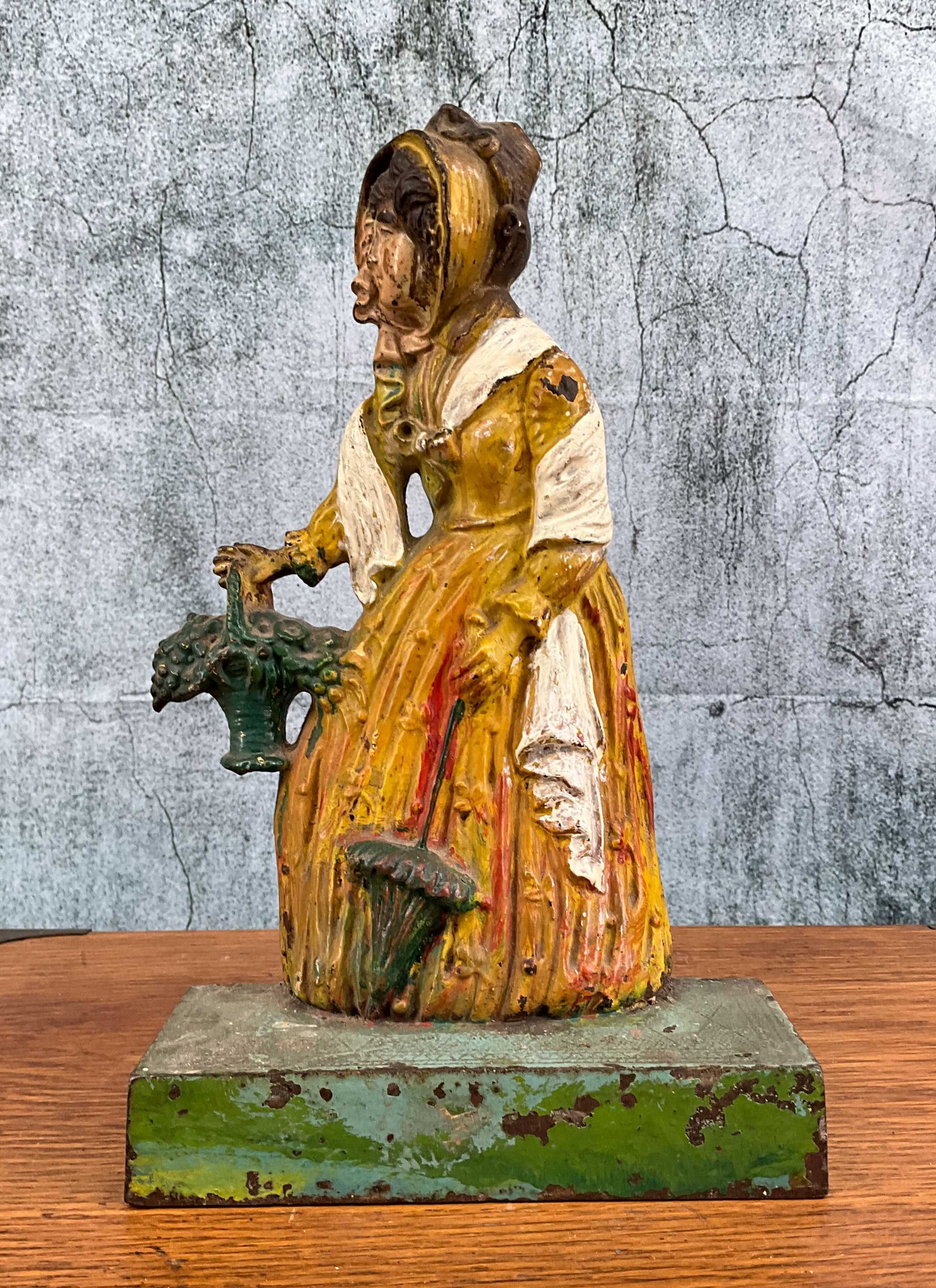 Bradley and Hubbard, Woman with Parasol, #7796: Bradley and Hubbard, Woman with Parasol, #7796. Cast iron Doorstop. Height: 11" Provenance: Single owner collection, suburban Philadelphia estate. Shipping Note: For your convenience, we have arranged