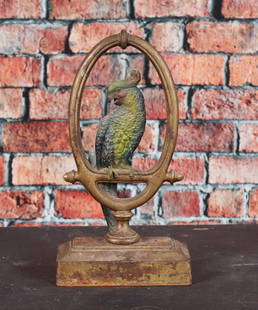 Large Parrot in a Ring Doorstop Cast Iron: Cast iron parrot in large ring doorstop, Bradley & Hubbard, full round figure, multi part cast with seem, original paint, original rubber bumpers. Provenance: Single owner collection, suburban Philade