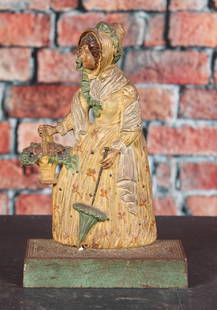 B&H #7796, Woman with Parasol, Doorstop, Cast Iron: Bradley & Hubbard #7796, Woman with Parasol, Doorstop, Cast Iron. Height: 11" Provenance: Single owner collection, suburban Philadelphia estate Shipping Note: For your convenience, we have arranged wi