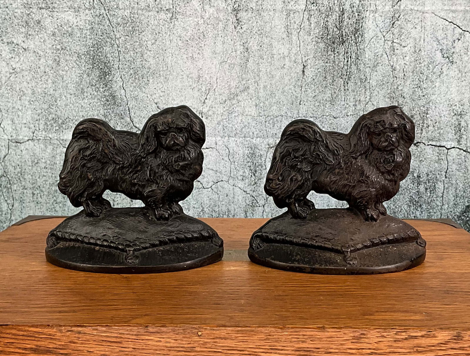 Pair King Charles Spaniel Bookends, #946: Pair King Charles Spaniel Bookends, #946. Cast Iron. Height: 5.5" Provenance: Single owner collection, suburban Philadelphia estate Shipping Note: For your convenience, we have arranged with Craig Vog