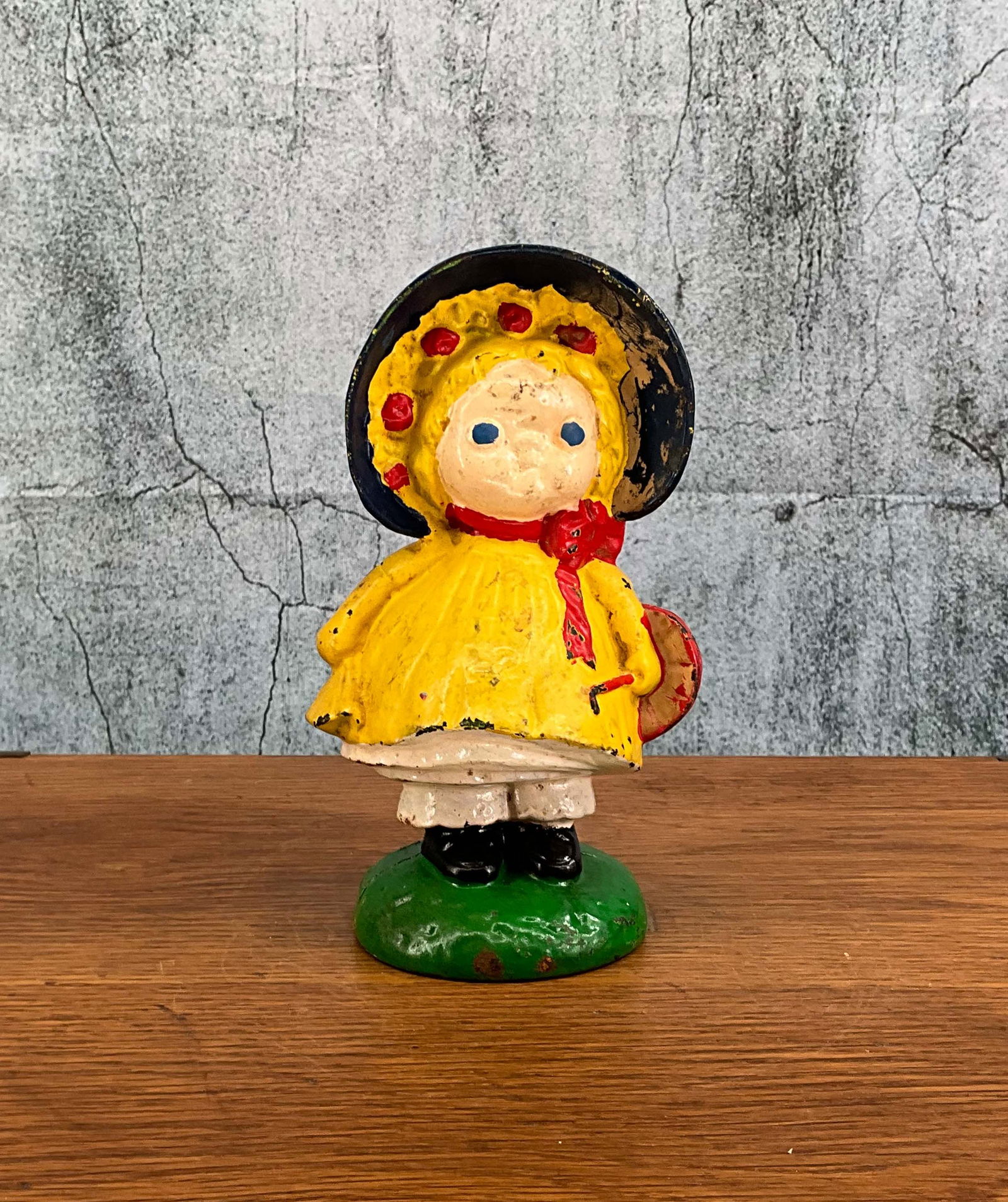 Dolly Dingle Still Bank: Dolly Dimple cast iron bank and doorstop combo, by Hubley, designed by G.G. Drayton, 2 piece hollow mold connected with bolt, full round figure, over painted. Provenance: Single owner collection, subu