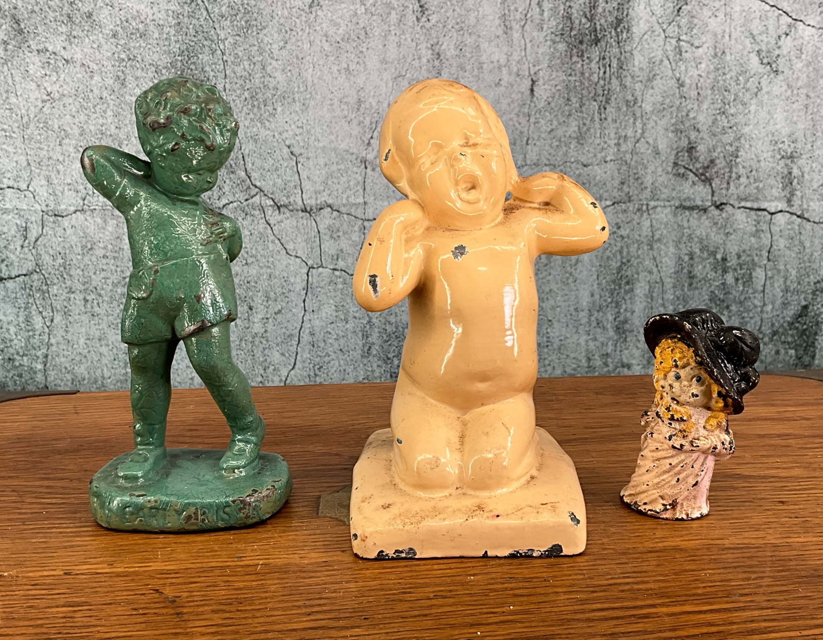 Group of Early 20 C. Bibelots, inc. Dutchess Mini: Grouping of three figures, single piece casts with over paint. Provenance: Single owner collection, suburban Philadelphia estate. Size: tallest 6.25"T Shipping Note: For your convenience, we have arra