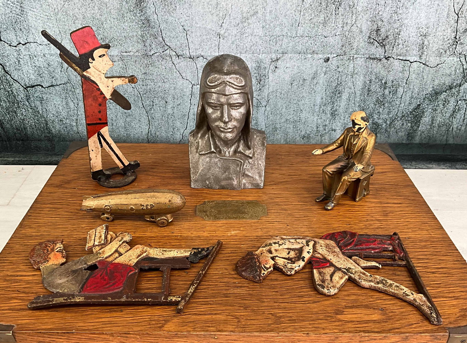 Group of Metal Bibelots, Lindbergh, et al: Selection of figurines, statuettes. Lindeberg bust, soldier, school child, and more. Various makers, all full round casts. Provenance: Single owner collection, suburban Philadelphia estate.. Size: var