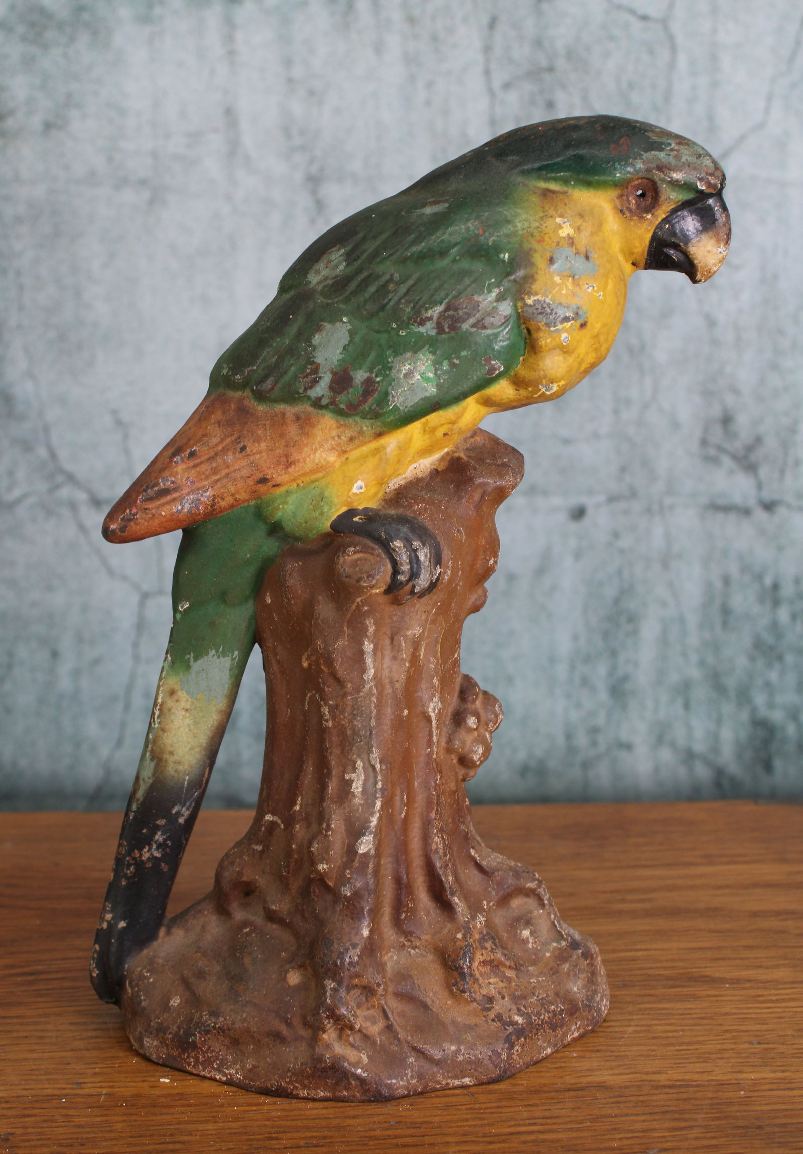 Parrot on a Branch, Cast iron Doorstop: Parrot cast iron door stop, missing original glass eye, IMO Greenblatt design #40, single piece cast with flat back. Provenance: Single owner collection, suburban Philadelphia estate. Size: 10.5"T Shi