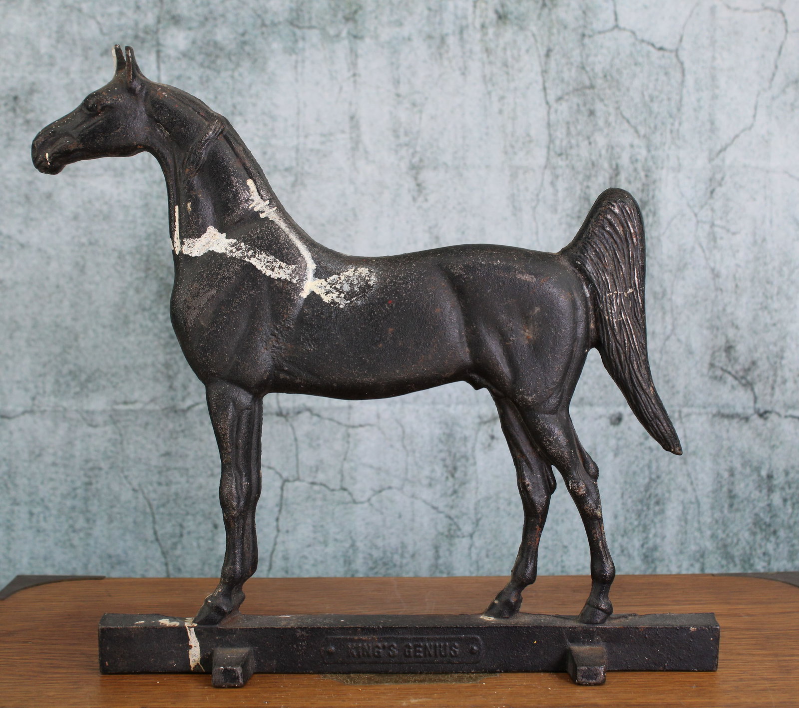 King's Genius, Horse Door Wedge, Cast Ion: Cast iron wedge door stop from King's Genius, single piece cast, stamped. Provenience; Single owner collection, suburban Philadelphia estate. Size: 11.75"T Shipping Note: For your convenience, we have
