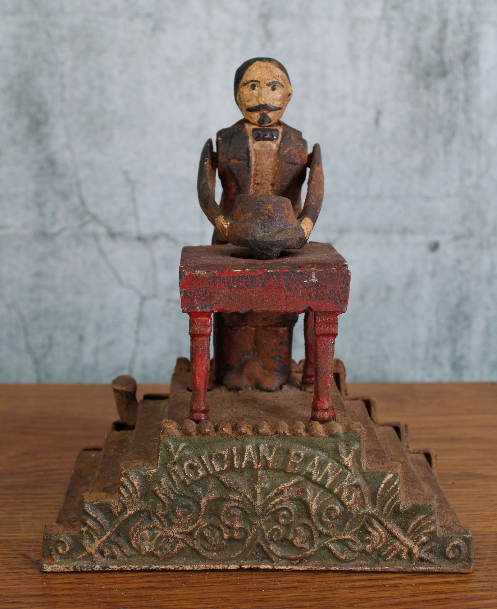 Magician Bank Mechanical Bank: Multi piece cast iron mechanical bank, Magician, original design by Charles A. Bailey. Unmarked. Provenance: Single owner collection, suburban Philadelphia estate. Size: 8"T Shipping Note: For your co