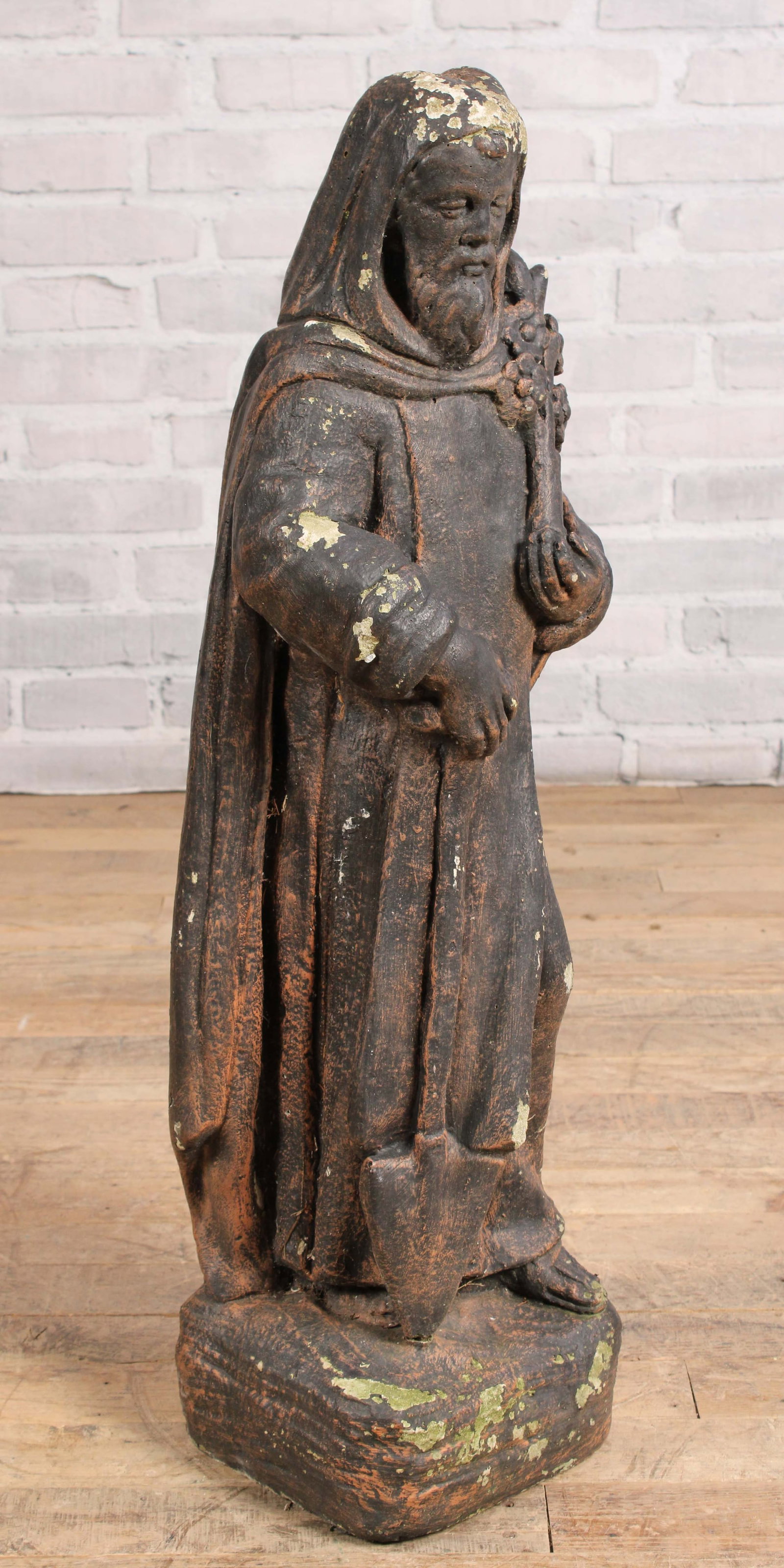Cast Stone St Fiacre Garden Statue: Cast stone garden statue of St Fiacre, patron saint of gardeners and herbalists. Always depicted with his trusty shovel. Great patina. Size: 31.5"T x 10"W x 9"D