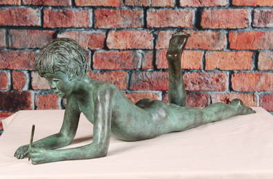 Figural Bronze Boy, Prone with Stylus