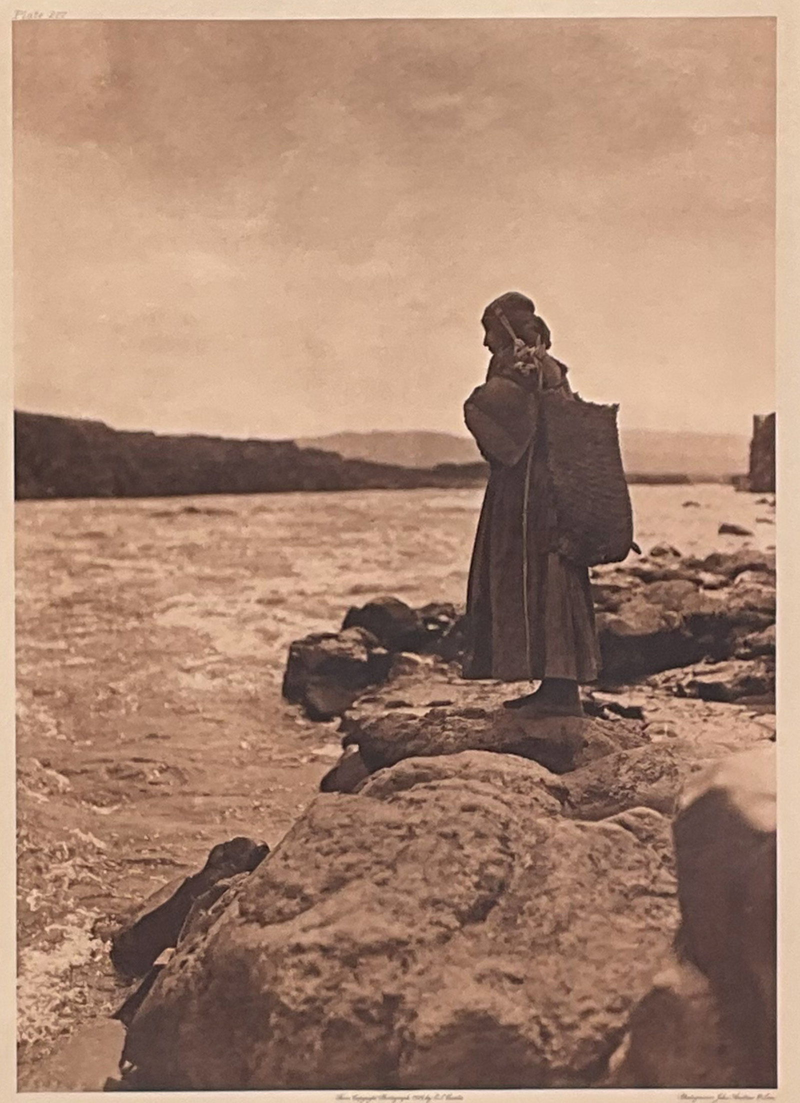 Edward Curtis, The Fish Carrier - Wishham, Plt.277: Edward S. Curtis, Photographer. Photogravure from The North American Indian: The Fish carrier - Wisham. Plate 277. Plate number at upper left, title at lower left, and captioned at the bottom "From Co