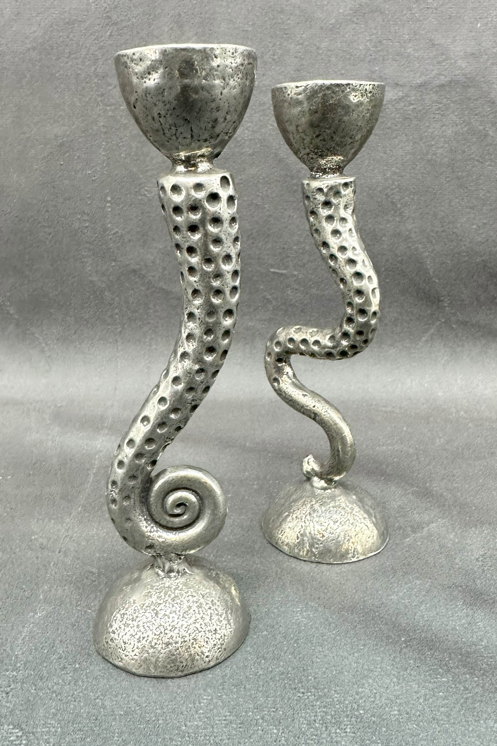Arthur Court Style Silver Tentacle Candlesticks: Octopus tentacle shaped candle stick pair with miss matched asymmetric form. Size: 5.75"T x 1.5" diameter base