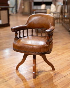 Late 19th C English Leather Library Chair: A good English late 19th Century leather chair having turned spindle back and revolving base. Size: 35"H x 26"W x 22"D Circa: 1890. List Price: $3900