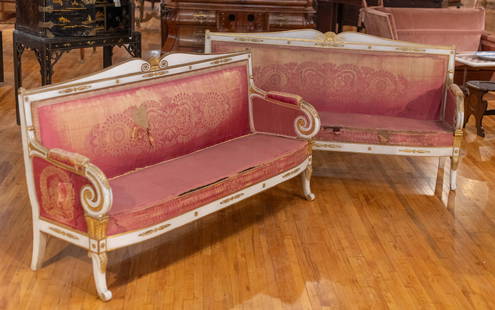 Pair 19th C Continental Painted Sofas: A pair of 19th Century continental gilt wood and paint decorated sofas, each having shaped crest rail and scrolling arms framing an upholstered back and seat all raised on shaped feet. Size: 42"H x 49