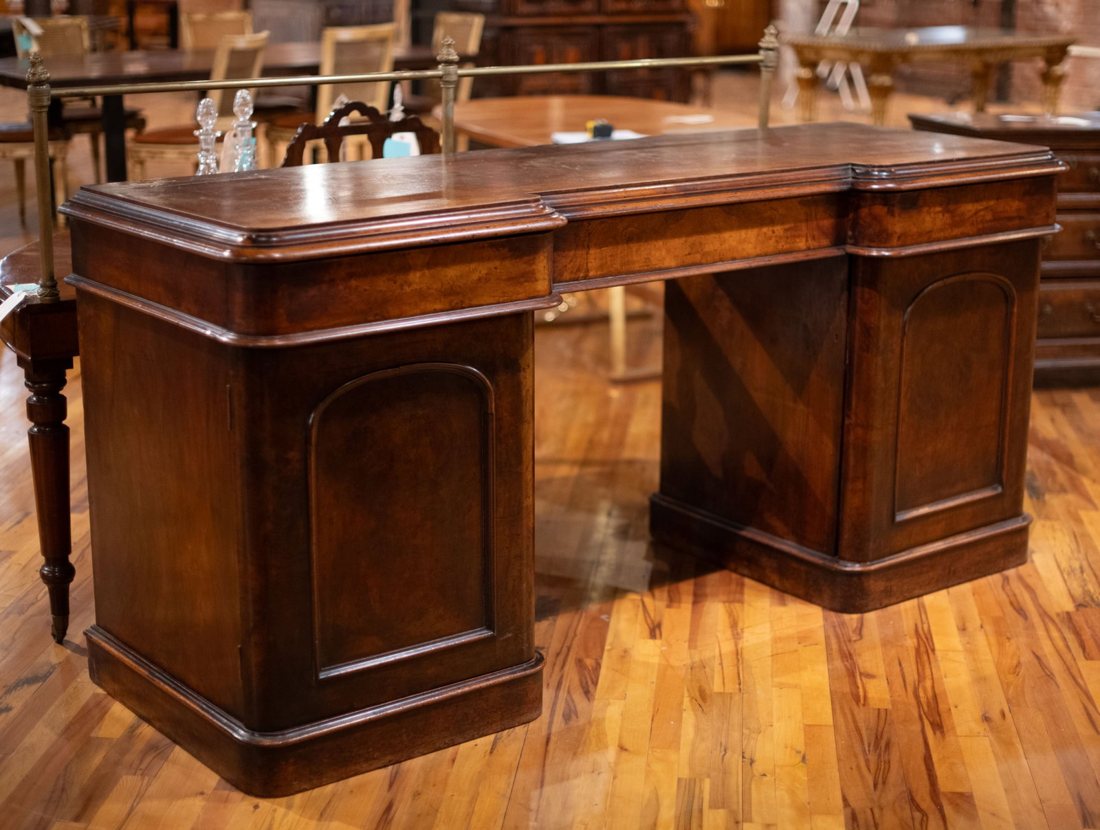 English Mahogany Pedestal Sideboard: 19th Century English Mahogany pedestal sideboard having stepped top over three blind drawers and fitted interior supports. Size: 39"H x 84"W x 29"D Circa: 1860 List Price: $5900