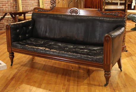 William IV Leather Sofa: A good English William IV mahogany leather sofa having carved crest rail framing an upholstered back and button tufted seat raised on turned feet. Size: 40.5"H x 75"W x 31"D Circa: 1880 List Price: $1