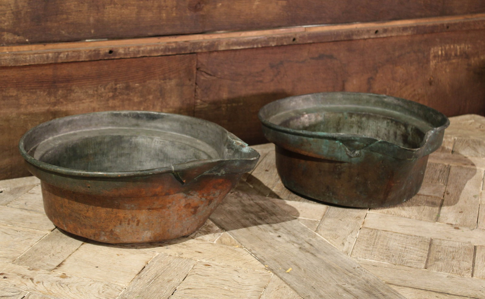 Pair, French Copper Wine Overflows: Rustic patinated copper wine overflows from France. Size: 7"T x 17" diameter, each Circa: 1820 List Price: $960Each