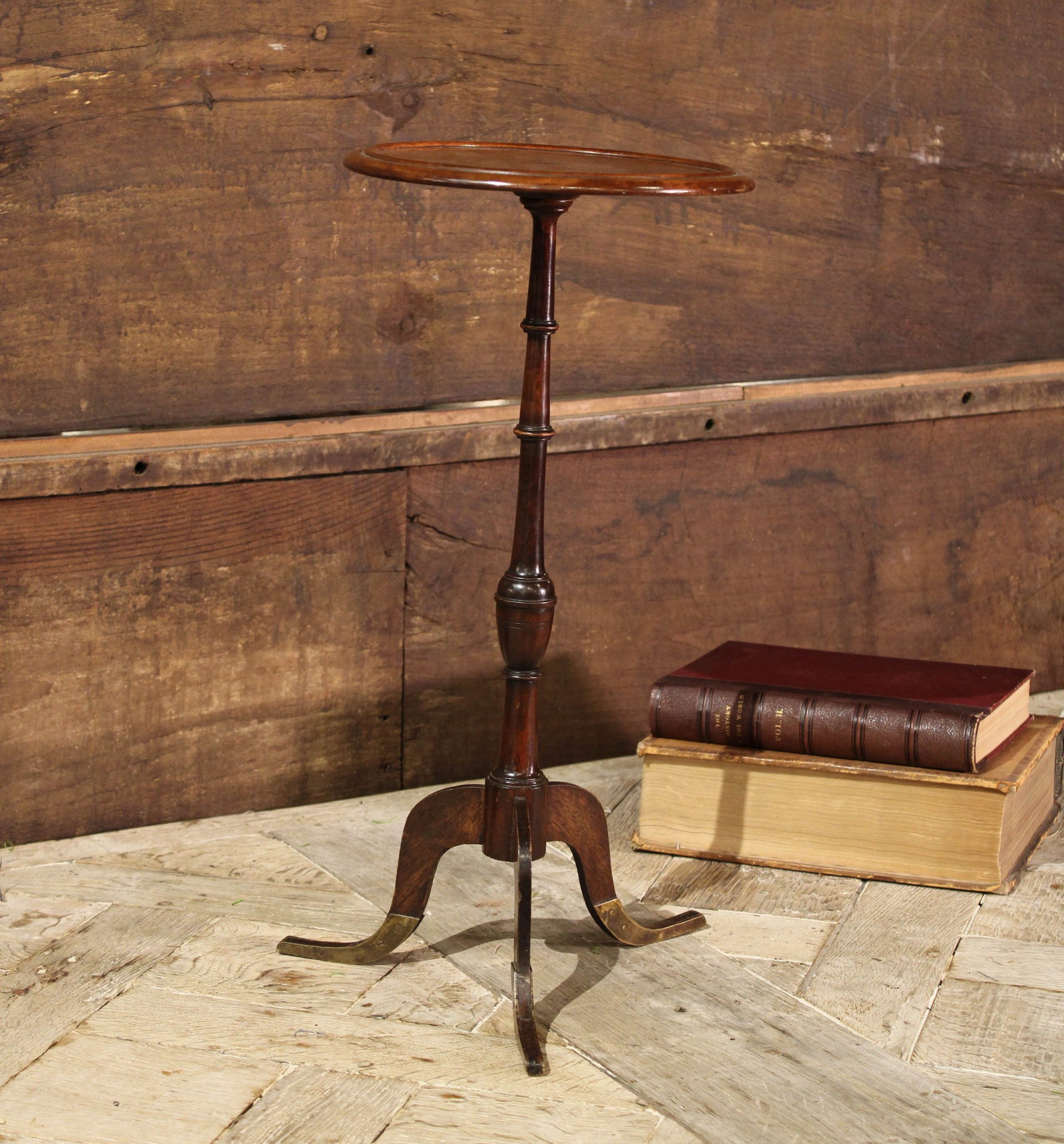 English Wine Table, Plant Stand: Small English drinks table, side table, stand, repairs to feet in brass. Size: 21"T x 12" diameter Circa: 1860 List Price: $2375 Books not included.