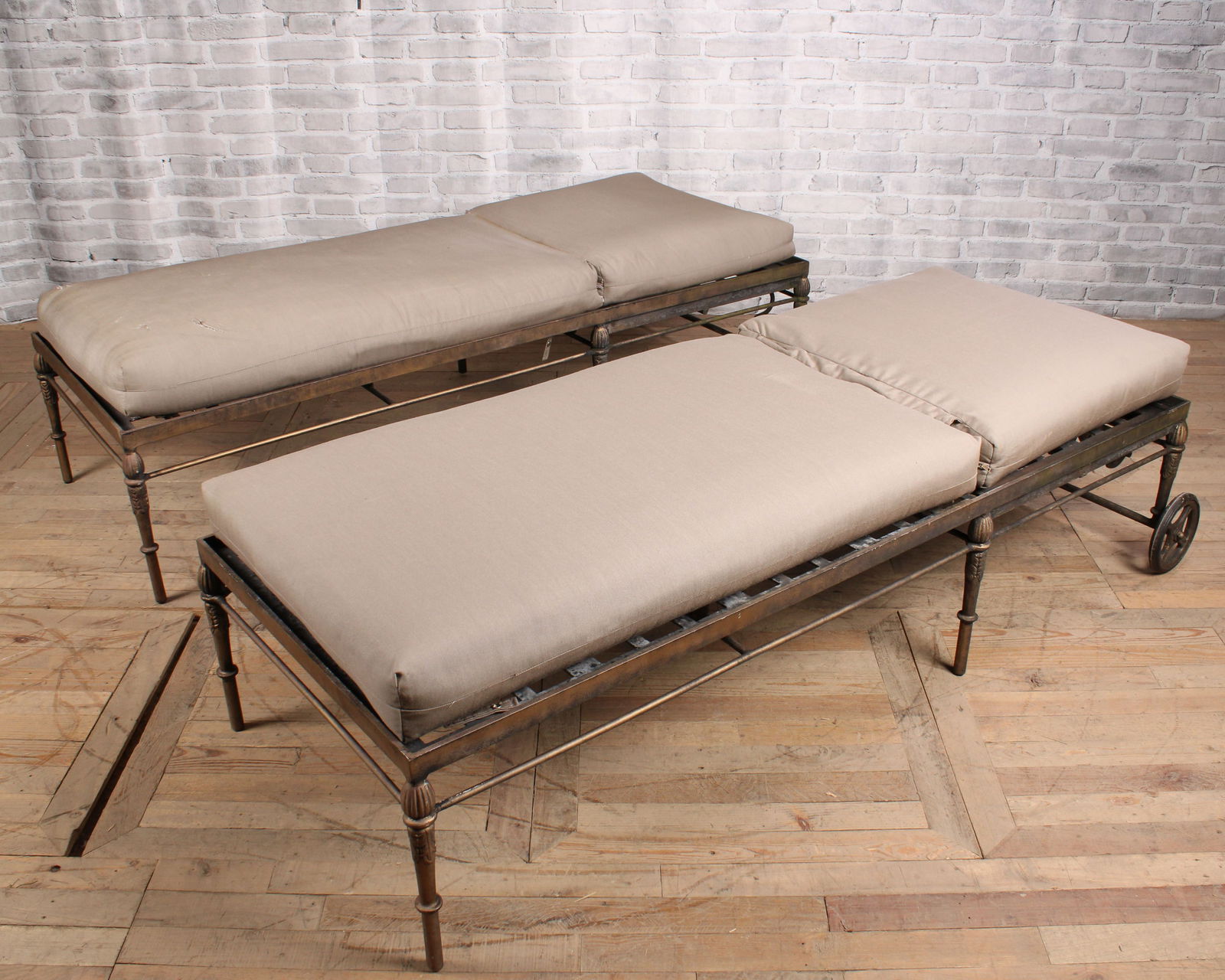 Pair Chaises Longue, Michael Taylor, Montecito: Pair of wheeled chaise lounges, Michael Taylor Montecito collection, with cushions. From a private Princeton Estate. One is missing a support beam, one is missing a ratchet bracket. Sold as is. Size: