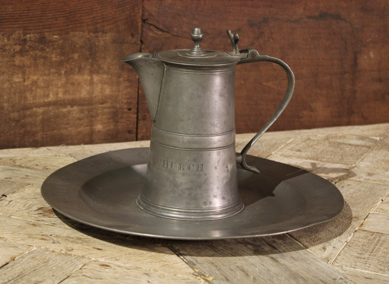 Pewter Pitcher and Charger: Pewter pitcher and charger set from Brownsfield Church. Size: 10"T x 6"L x 10"W pitcher; 16" diameter charger Circa: 1890 List Price: $1990