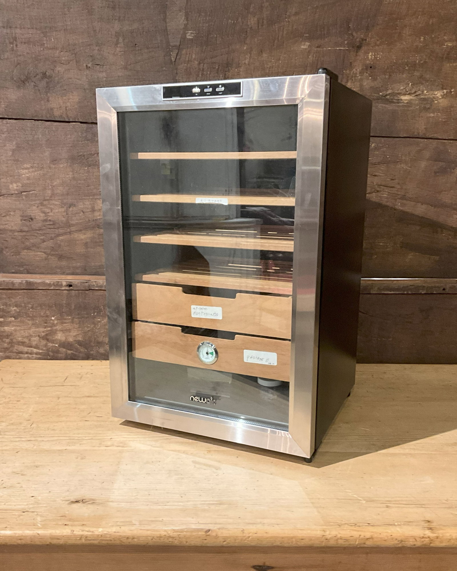 Newair Humidor, Spanish Cedar Interior: Newair electric humidor, approximately 500 count storage, Spanish cedar shelves, stainless steel door. Size: 29.5"T x 18"W x 21"D