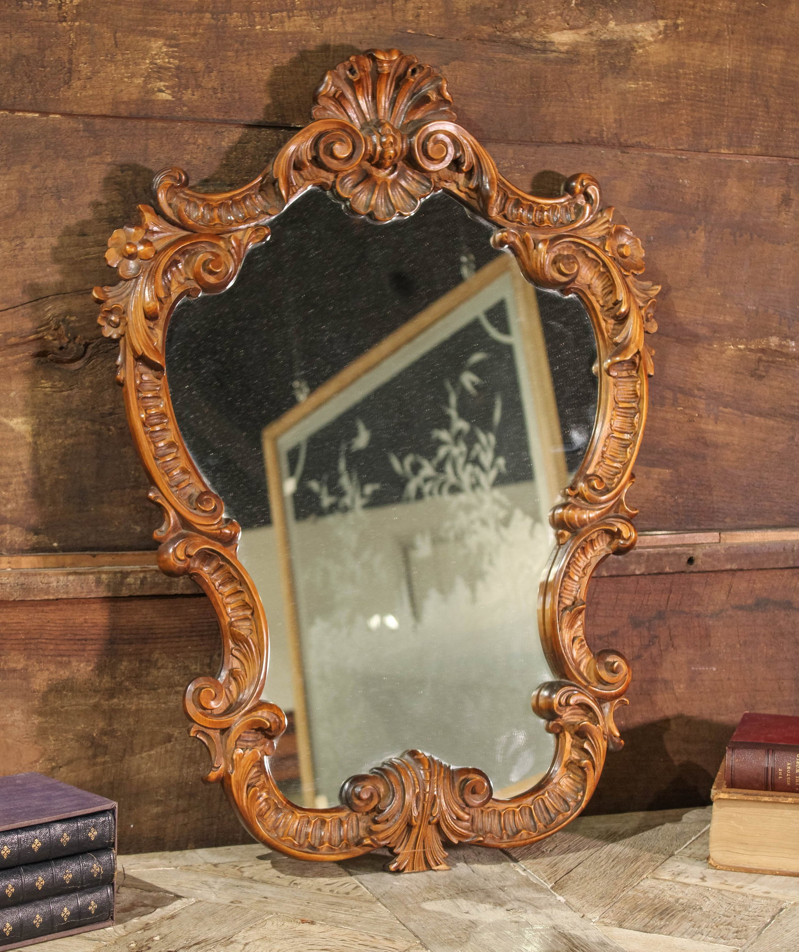 French Carved Scrollwork Mirror: Carved wood scrollwork mirror. Size: 32"T x 23"W Books not included.