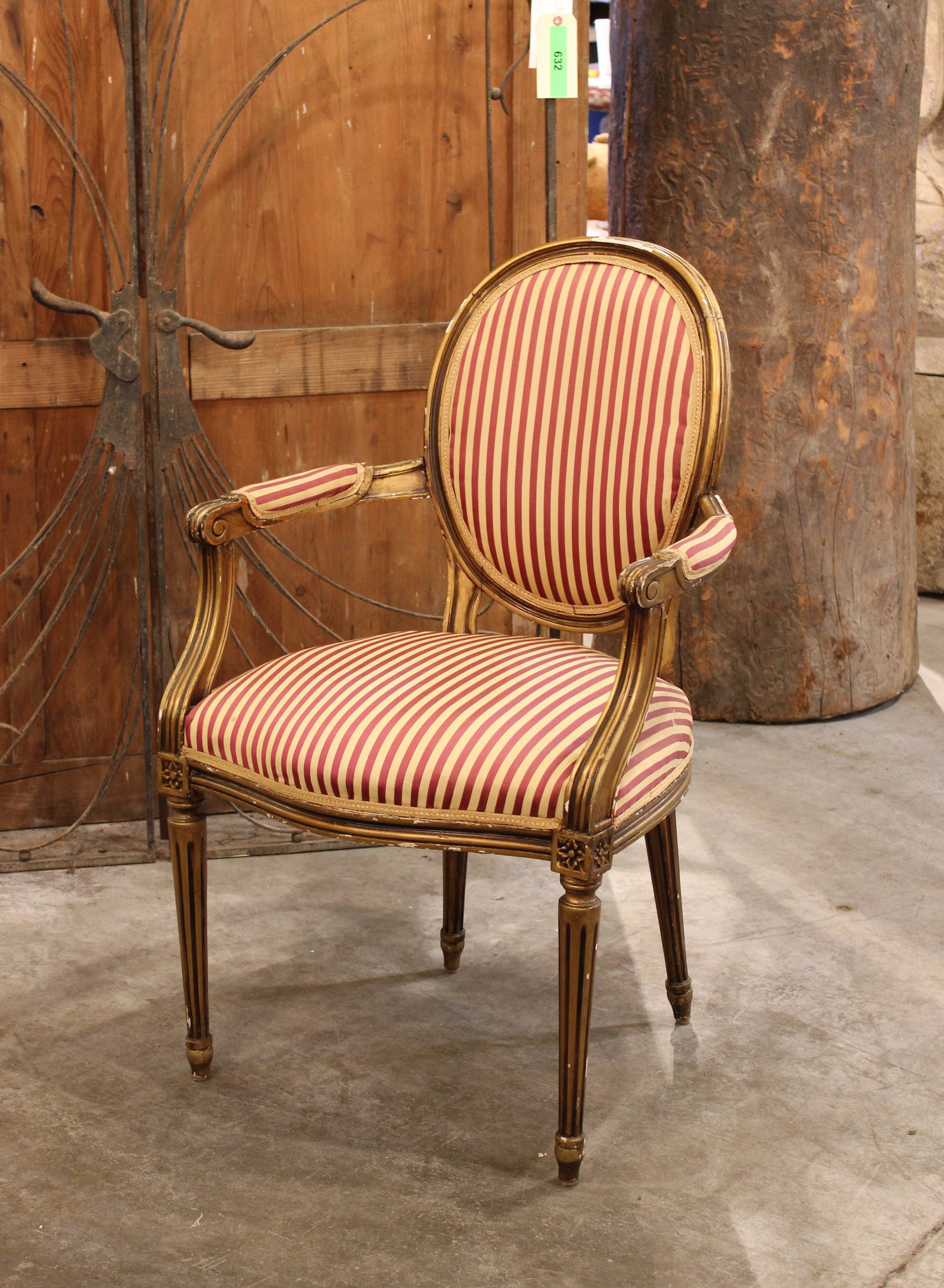 French Louis XVI Armchair: A French Louis XVI style gilt carved armchair. Size: 39"H x 24"W x 18"D, seat height 18.5" Circa: 1870 List Price: $2900