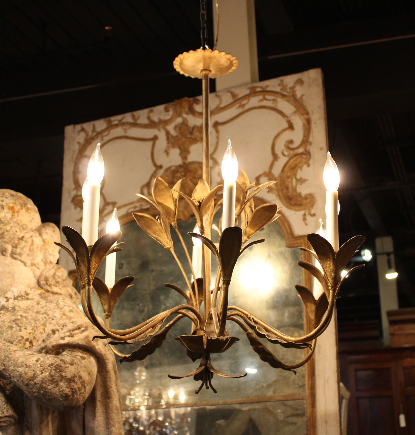 French Iron Chandelier, 8 Arm, Bloom Motif: 20th Century French wrought iron chandelier having stylized floral decoration and eight lights leaf form bobeche. Size: 30"H x 31" dia Circa: 1920 List Price: $8900