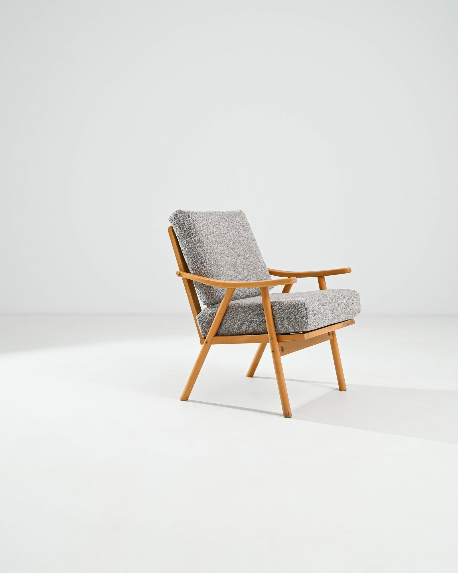 Czech Design Modern Armchair: Modernist European arm chair, wood base with heather grey boucle upholstery. Dimensions: H 35.75" x W 24" x D 25.25" Origin: Czechia, 1970** Please Note: All items are located in High Point, NC. Pleas
