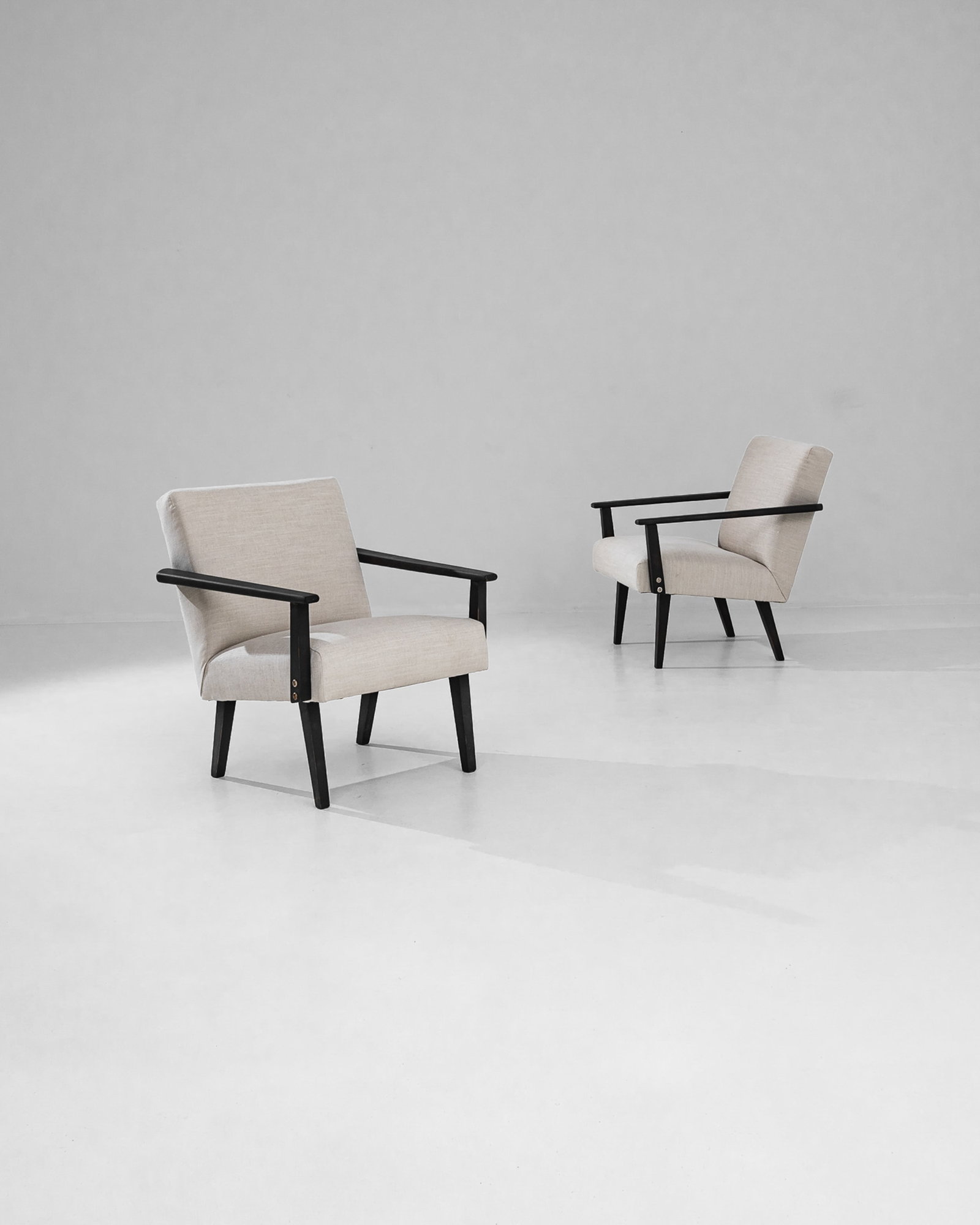 Pair Continental Modern Lolling Chairs: Pair Continental Modern Lolling Chairs. Eased seats with shaped legs and arms. Dimensions: H 29.25" x W 25.25" x D 26.00" Origin: Czech Republic, 1960** Please Note: All items are located in High Poin