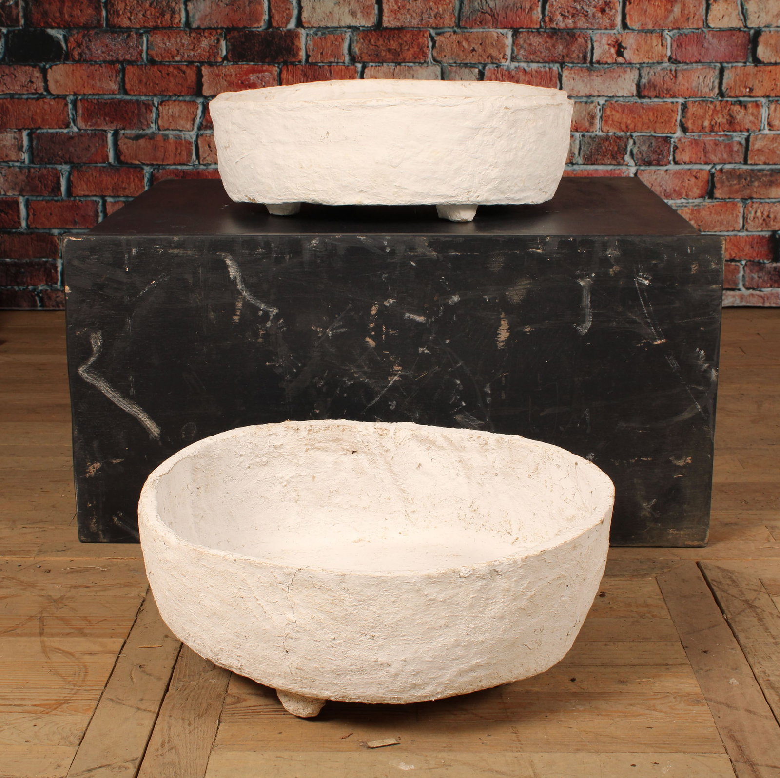 Pair Sculpted Paper Pulp Planters: Pair of Sculpted paper pulp planters, with feet, no drainage holes. Size: larger 9" x 24"Dia (irregular) smaller 8"H x 24"Dia.