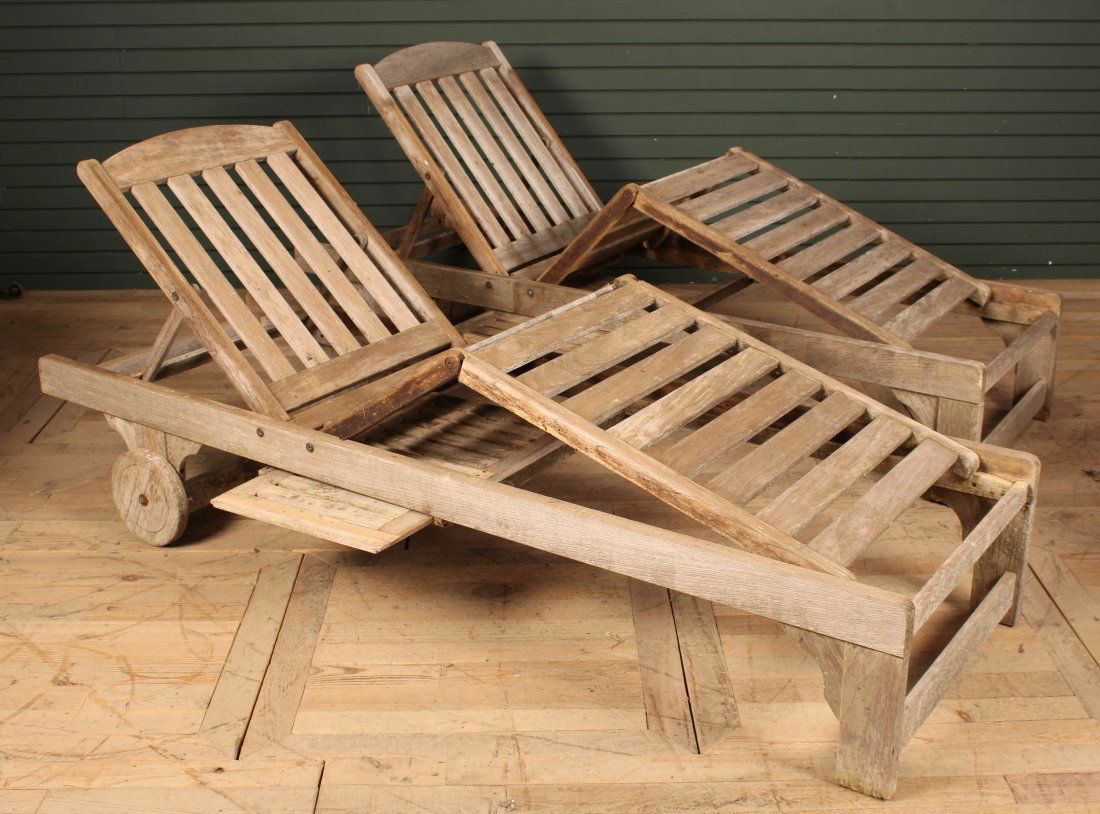 Pair Vintage Silvered Teak Chaises: Pair Vintage Silvered Teak Chaises. Fully adjustable with a pull-out drinks table. Size: 14" H x 81" Long x 27" W