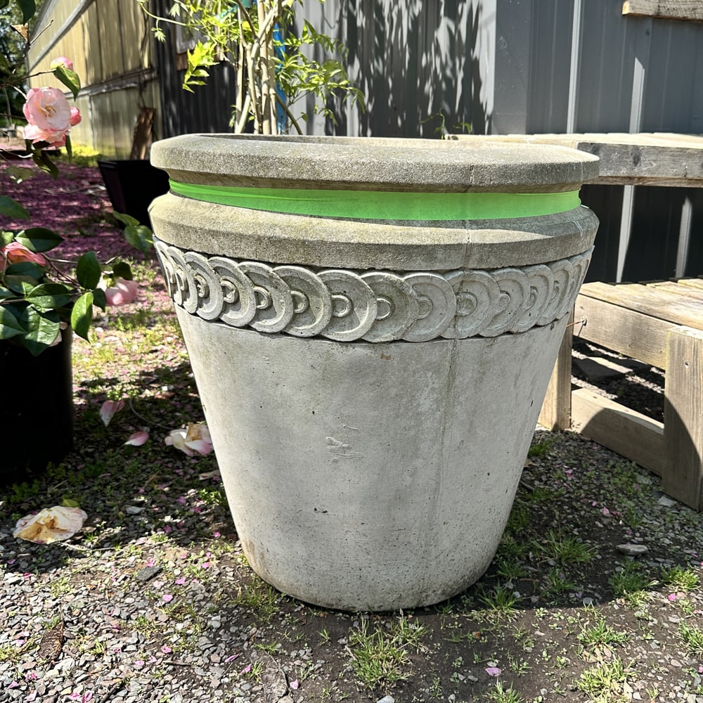 Large Planter With Coin Motif Border: Cast stone planter with great proportions, clean lines and a coin inspired border. Size: 24"T x 23.5" diameter