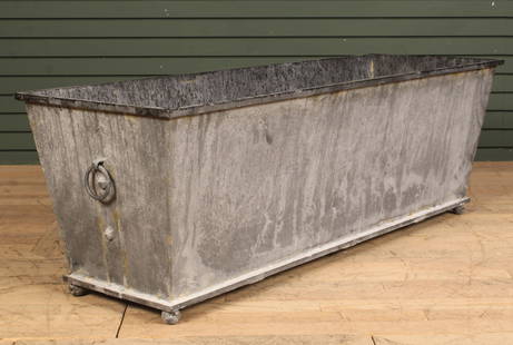 Regency Style Terrace Trough Planter: Large scale Regency style trough planter, rolled edge, raised on small round feet, and handles on either end. Size: 19.5" H x 59" W x 19.5" D